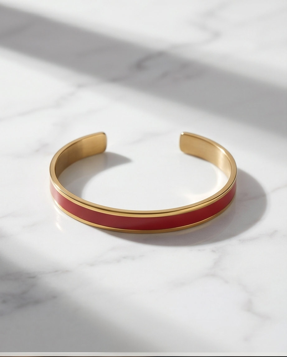 Esclava de acero dorado rígida color rojo